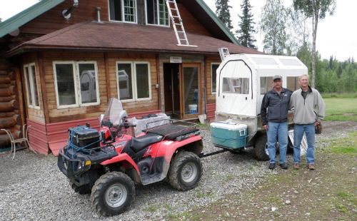 Guests with ATV and covered wagon at the homestead